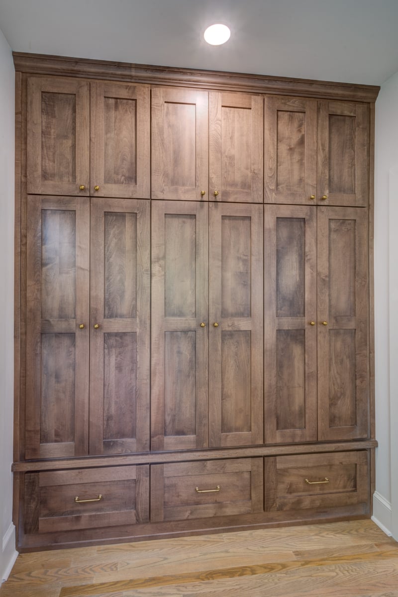floor-to-ceiling storage wall with closed shaker cabinets in first floor remodel in Atlanta.