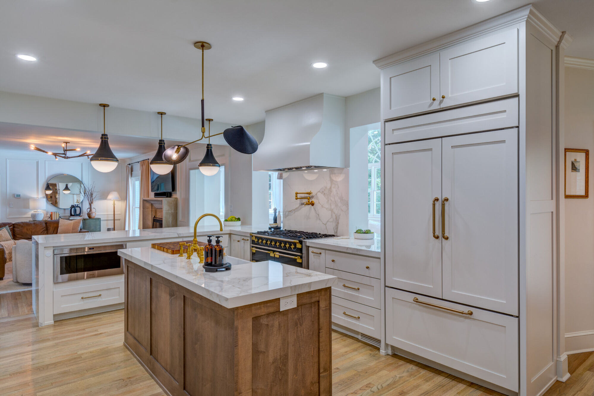 Brookfield kitchen renovation featuring island with marble countertop by Silver Oak Remodel