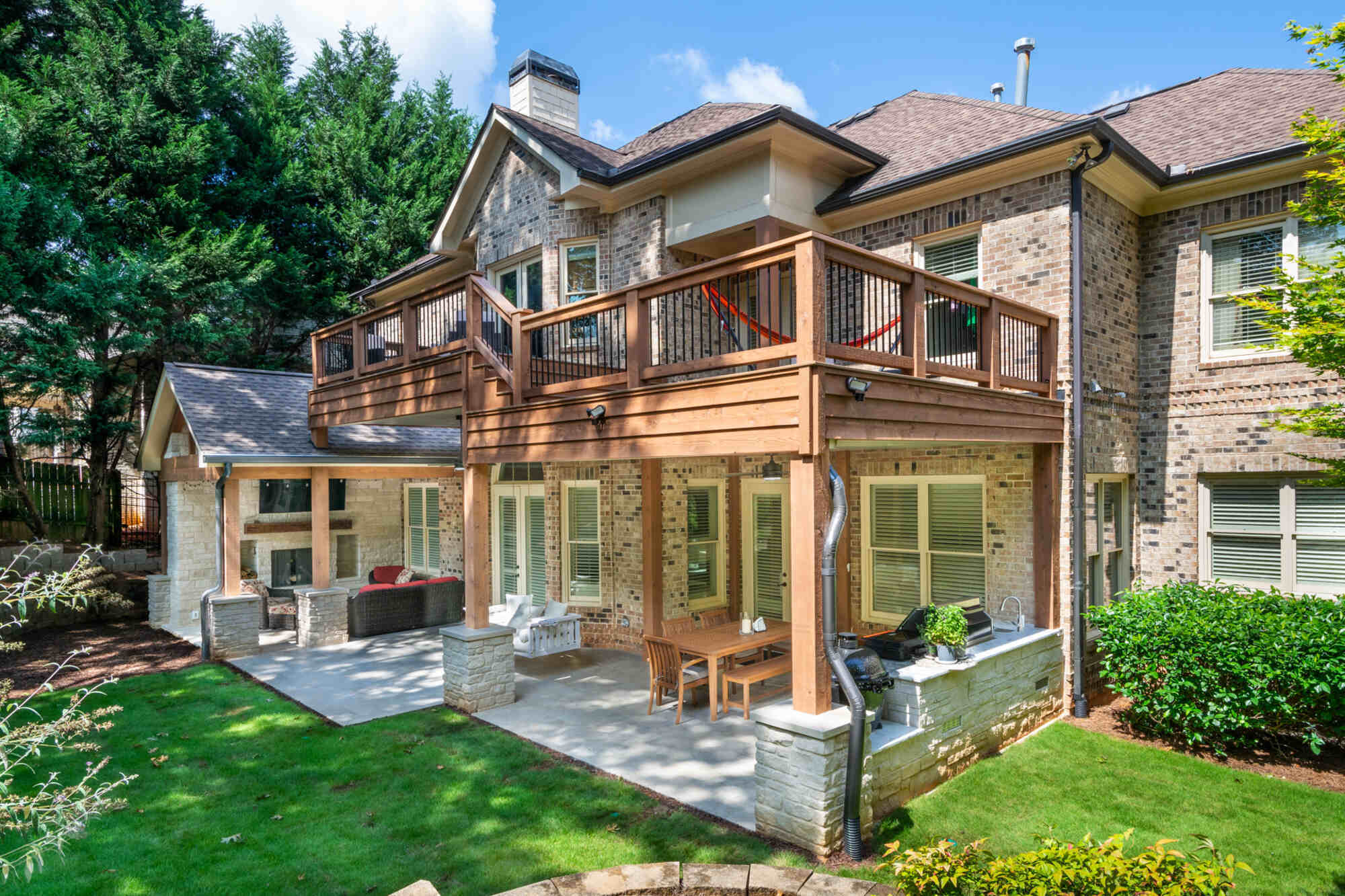 Brookfield outdoor living remodel with covered patio and upper-level deck by Silver Oak Remodel