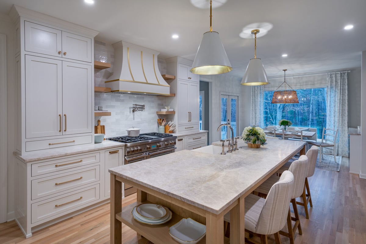 Expansive Atlanta kitchen remodel with large center island and pendant lights by Silver Oak Remodel