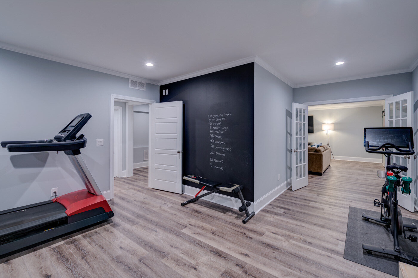 Modern home gym in a finished basement remodel by Silver Oak Remodel in Atlanta, GA