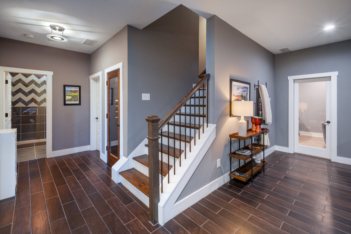 Stairway entrance to custom basement remodel in Atlanta by Silver Oak Remodel with tile flooring