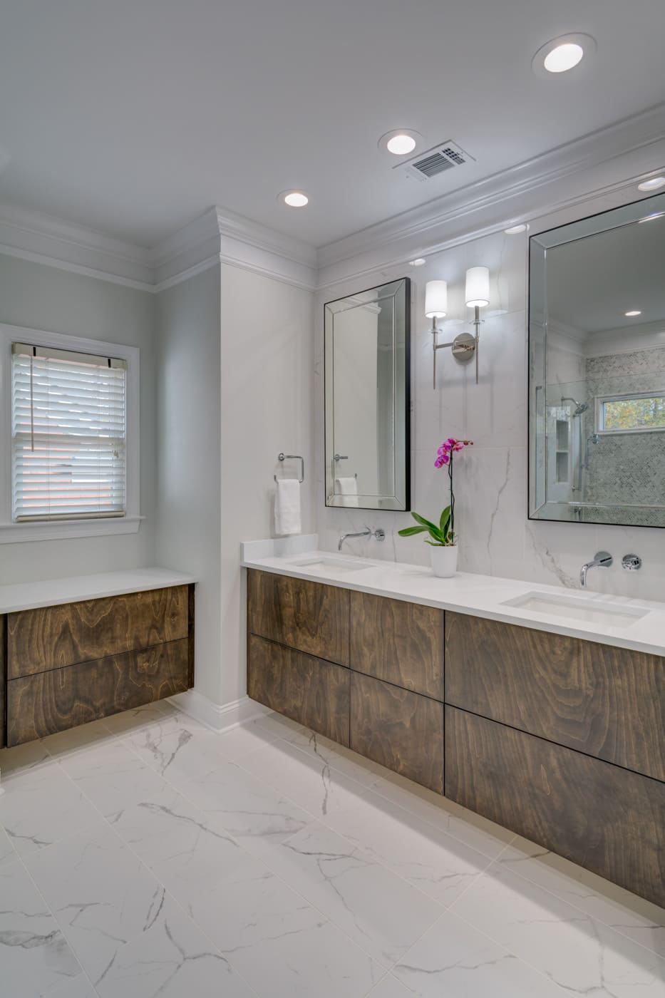 Dual-sink vanity with large mirrors in a custom bathroom build by Silver Oak Remodeling in Atlanta, GA