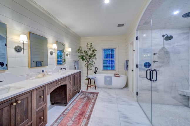 Rustic modern master bathroom with soaking tub and double mirrors, Atlanta build by Silver Oak Remodeling