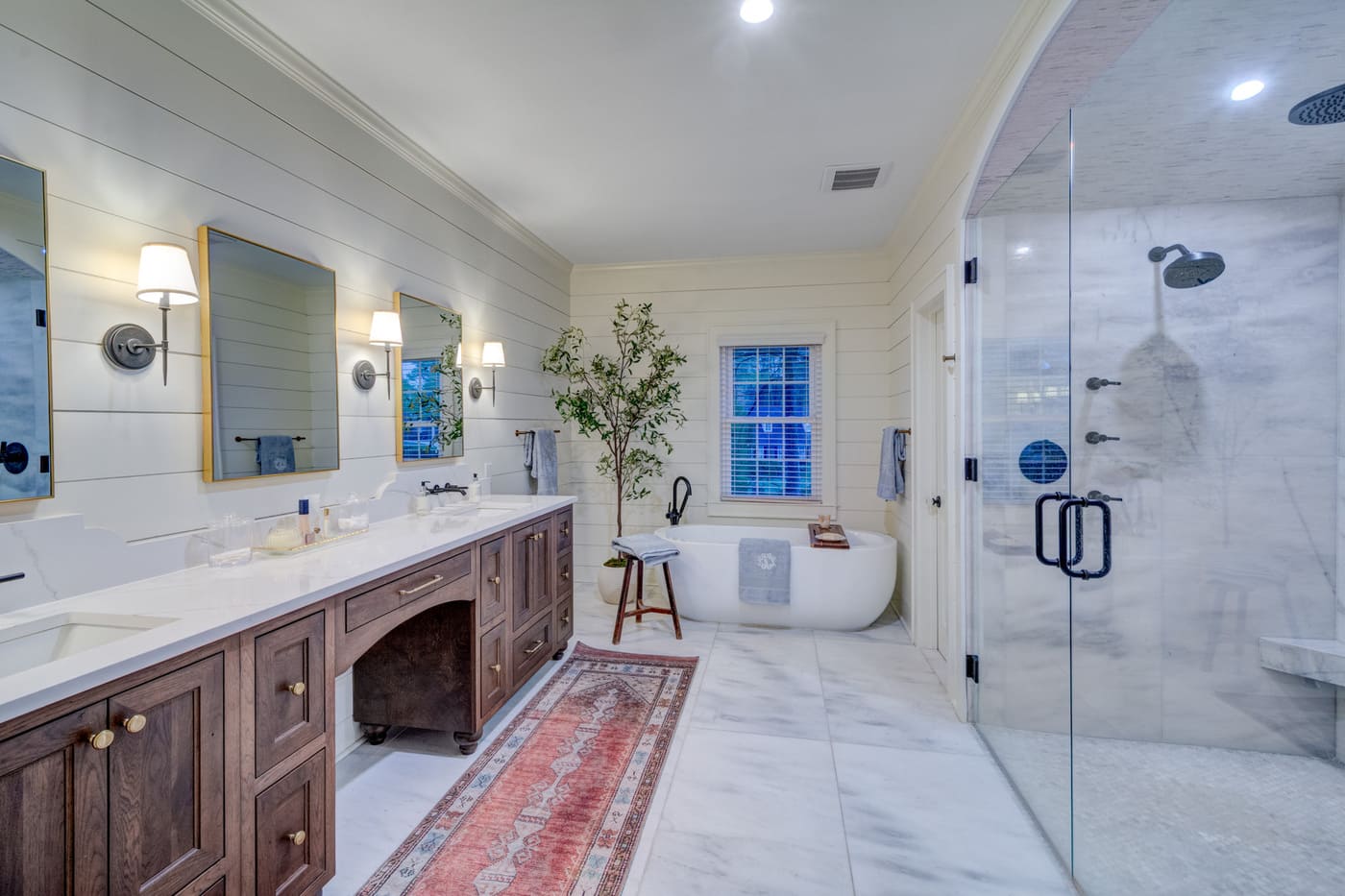 Rustic modern master bathroom with soaking tub and double mirrors, Atlanta build by Silver Oak Remodeling