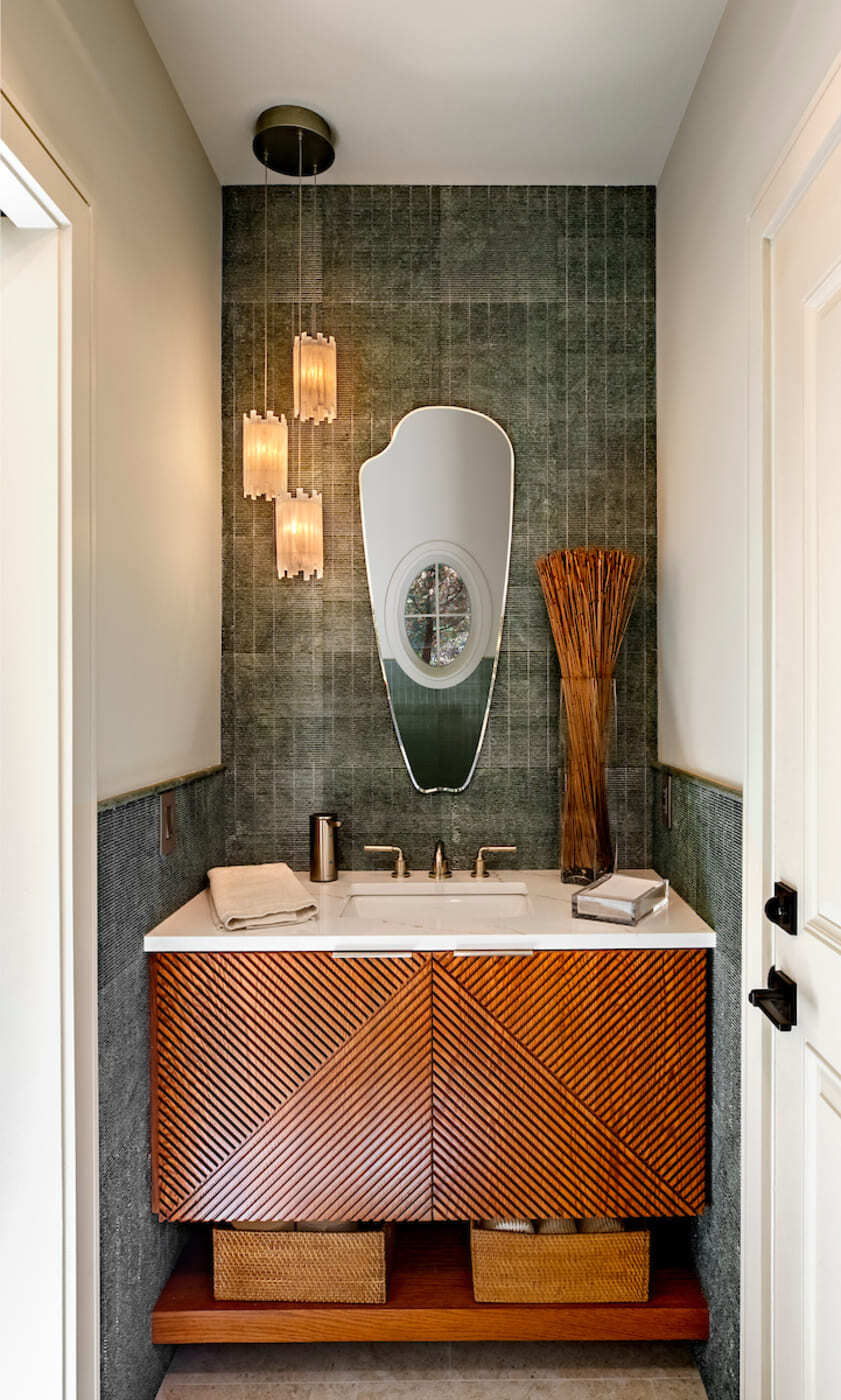 Contemporary bathroom with unique mirror and modern wood vanity in a custom home build in Atlanta, GA