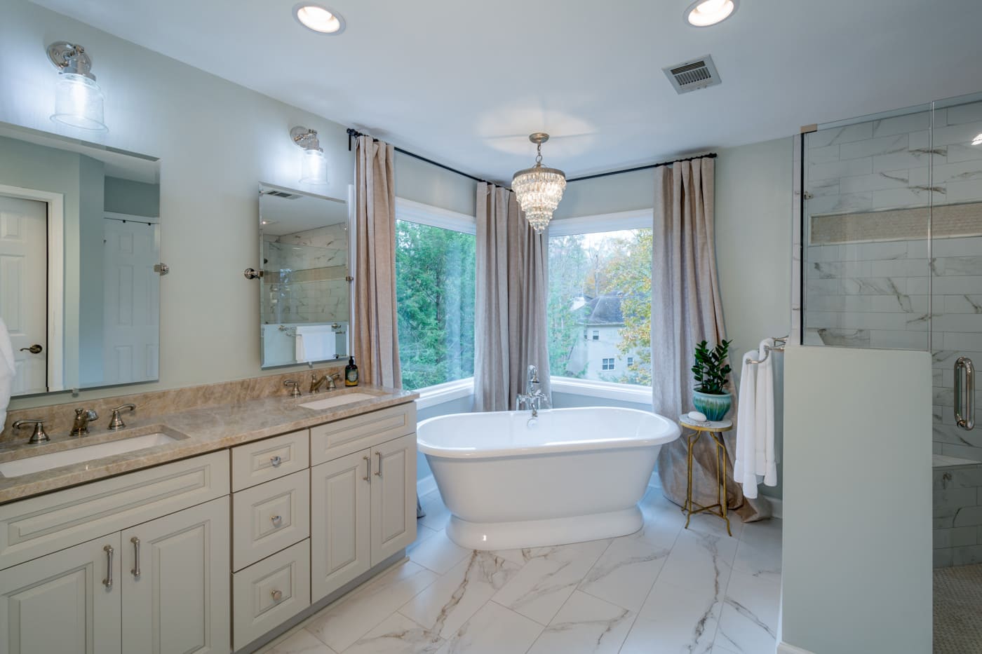 Luxurious bath retreat with marble floors and elegant fixtures in a Silver Oak custom home in Atlanta, GA