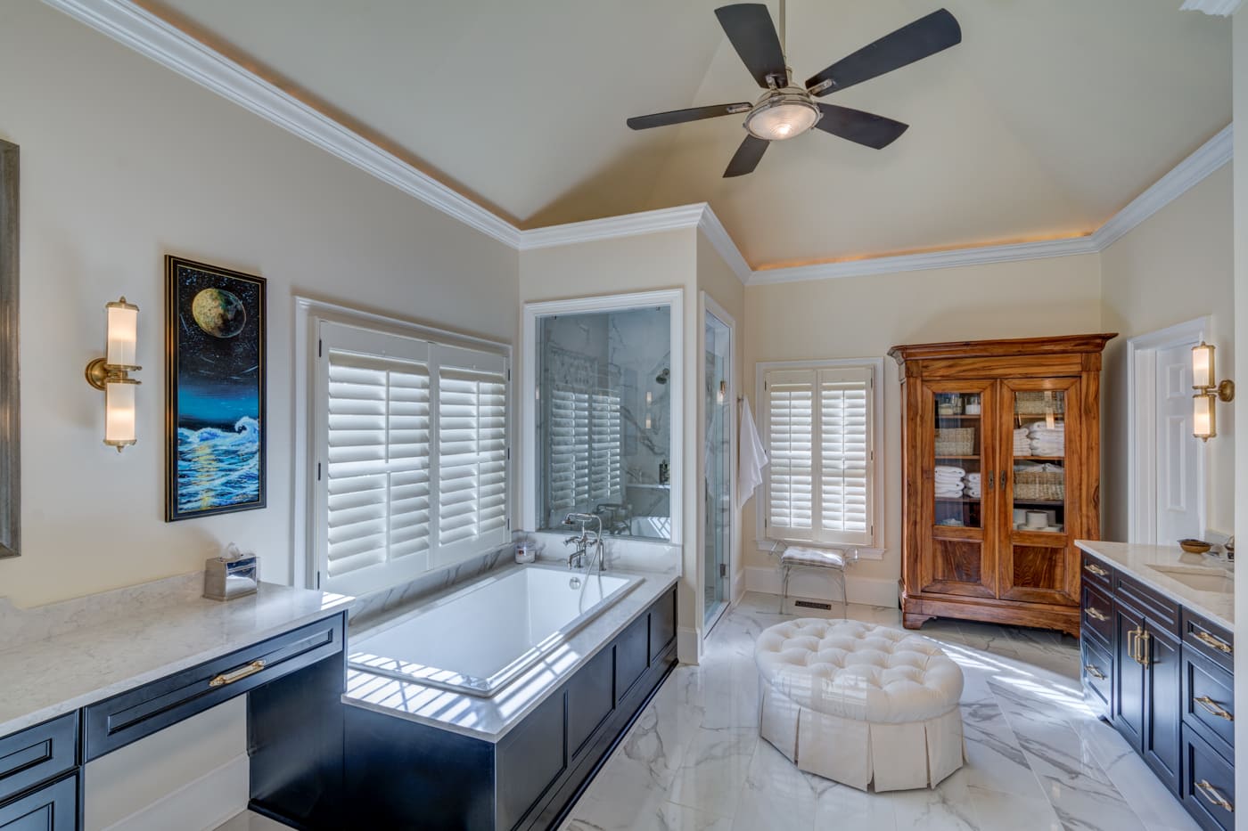 Traditional master bathroom with freestanding tub and plantation shutters in an Atlanta home by Silver Oak Rem