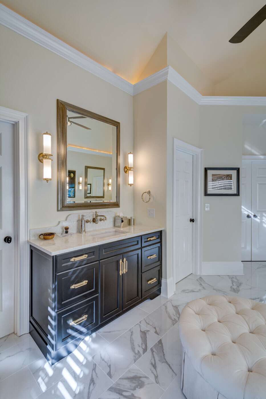 Single sink vanity with marble top in a master bathroom remodel by Silver Oak Remodel in Atlanta, GA