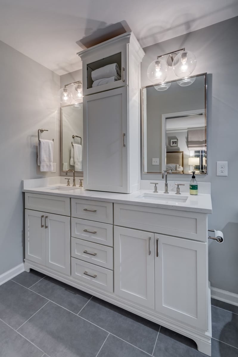Sophisticated white vanity design with ample storage by Silver Oak Remodeling in a custom Atlanta home