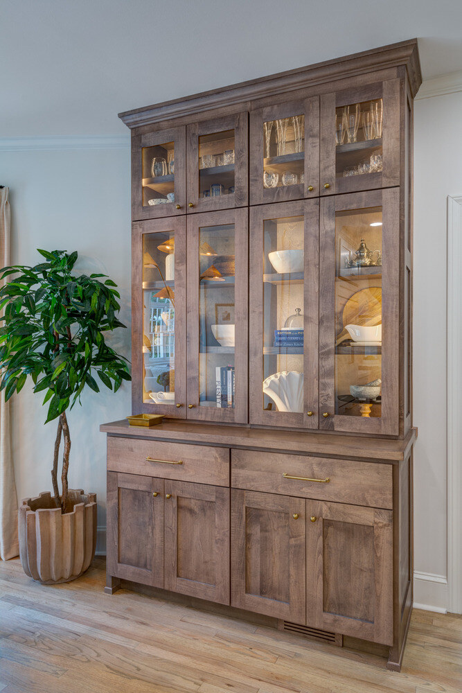Custom glass-front display cabinet in Brookfield dining space by Silver Oak Remodel