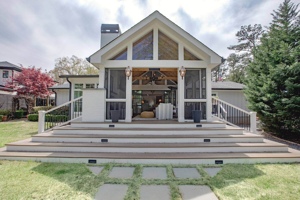 Custom screened-in porch addition by Silver Oak Remodel in East Cobb, GA with vaulted ceiling and wide staircase