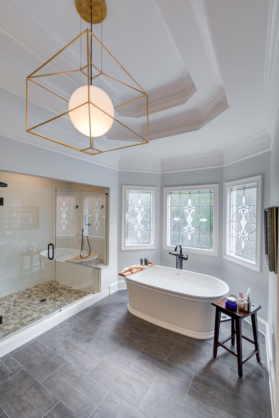 Atlanta bathroom remodel by Silver Oak Remodel featuring freestanding tub and custom stained glass windows