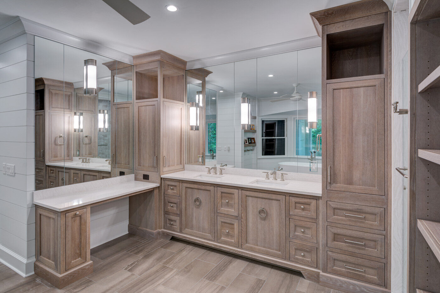 Contemporary bathroom remodel in Atlanta, GA by Silver Oak Remodel with wood cabinetry and mirrored walls