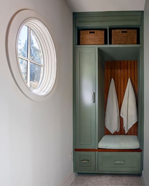 Custom green mudroom cabinetry in Atlanta home by Silver Oak Remodeling