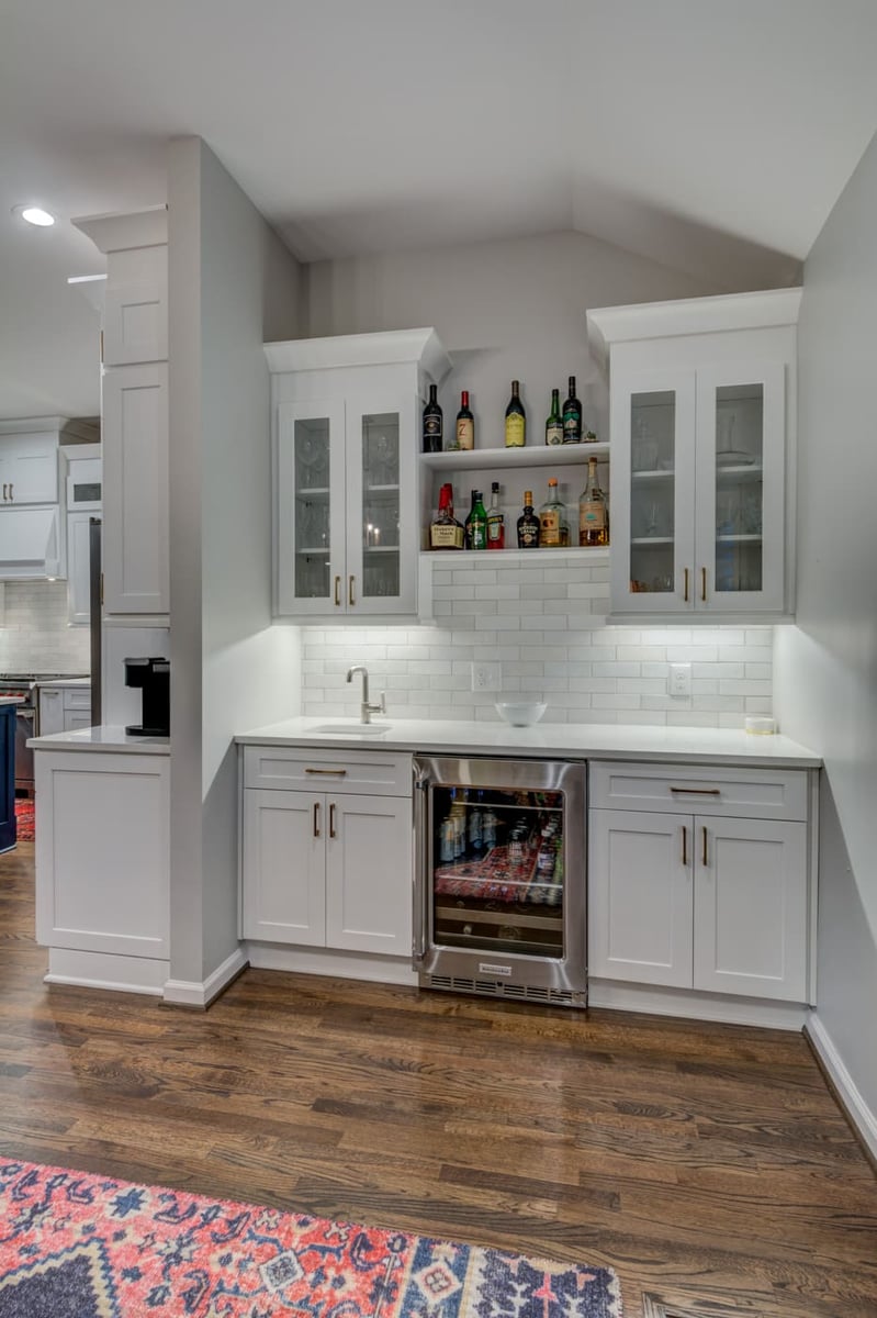 Atlanta home bar remodel with under-cabinet lighting and drink storage by Silver Oak Remodeling