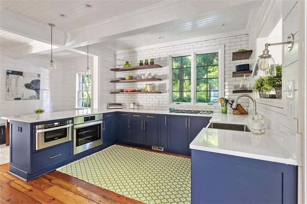 Blue and white kitchen renovation featuring natural light and open shelving by Silver Oak Remodeling in Atlanta