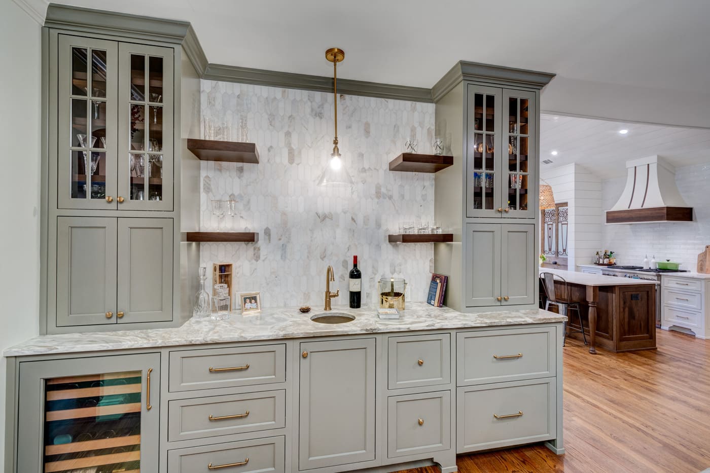 Built-in bar cabinetry with wine fridge and display shelves by Silver Oak Remodeling in Atlanta, GA