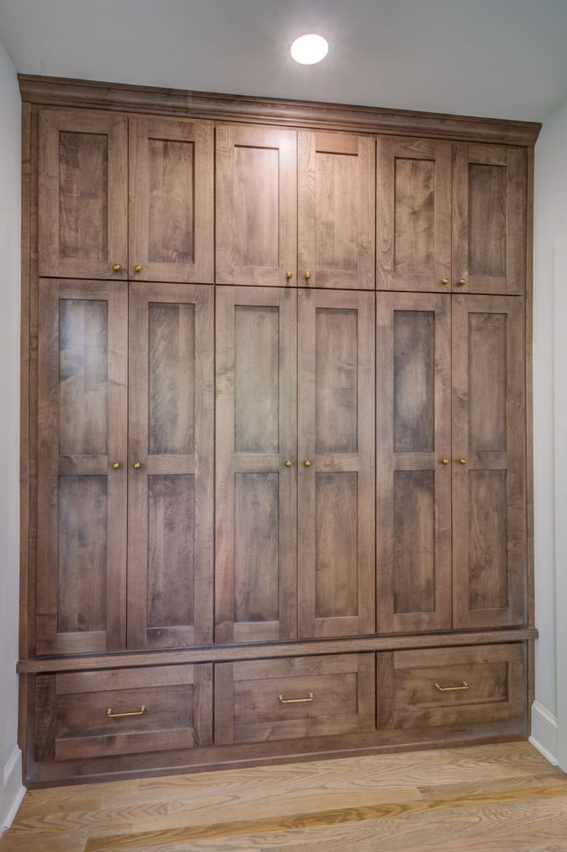 Floor-to-ceiling wood cabinet wall in custom Atlanta home by Silver Oak Remodeling