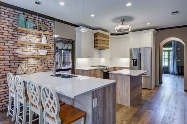 Kitchen with wood accents, floating shelves, and brick detail in Atlanta custom build by Silver Oak Remodeling