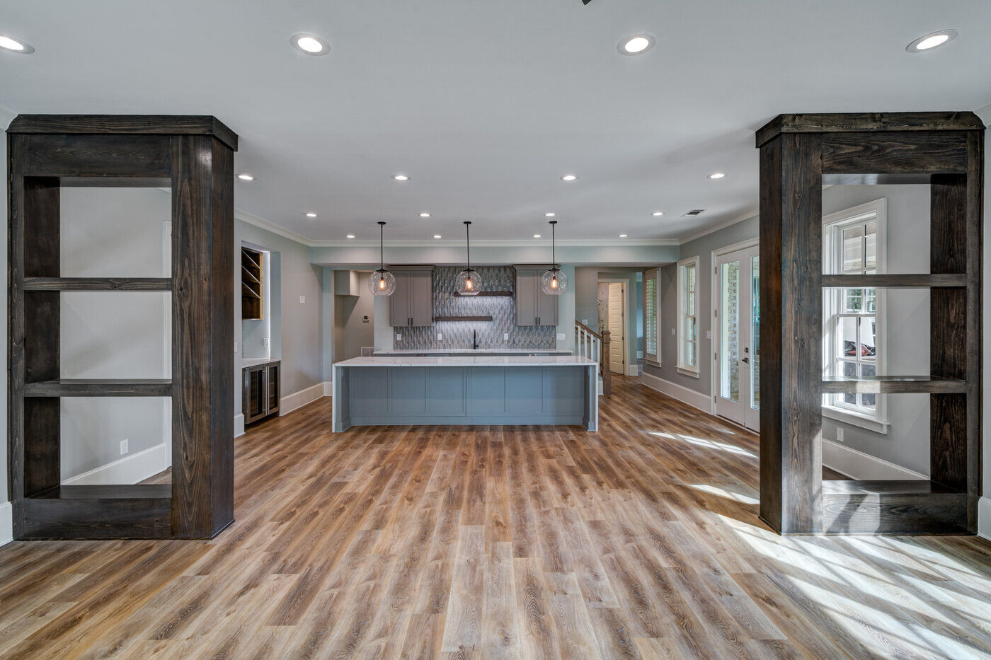 Open-concept kitchen remodel in Atlanta, GA by Silver Oak Remodel with floor-to-ceiling shelving