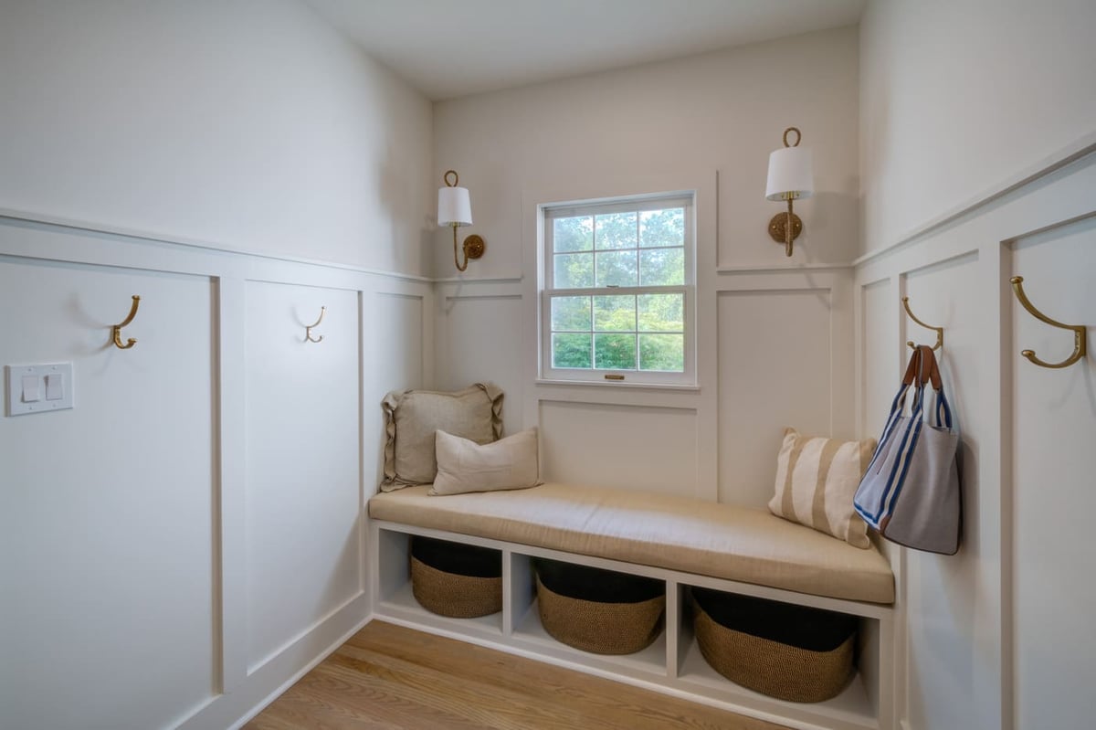 Silver Oak Remodeling’s custom-built mudroom with window bench and storage baskets in Atlanta, GA