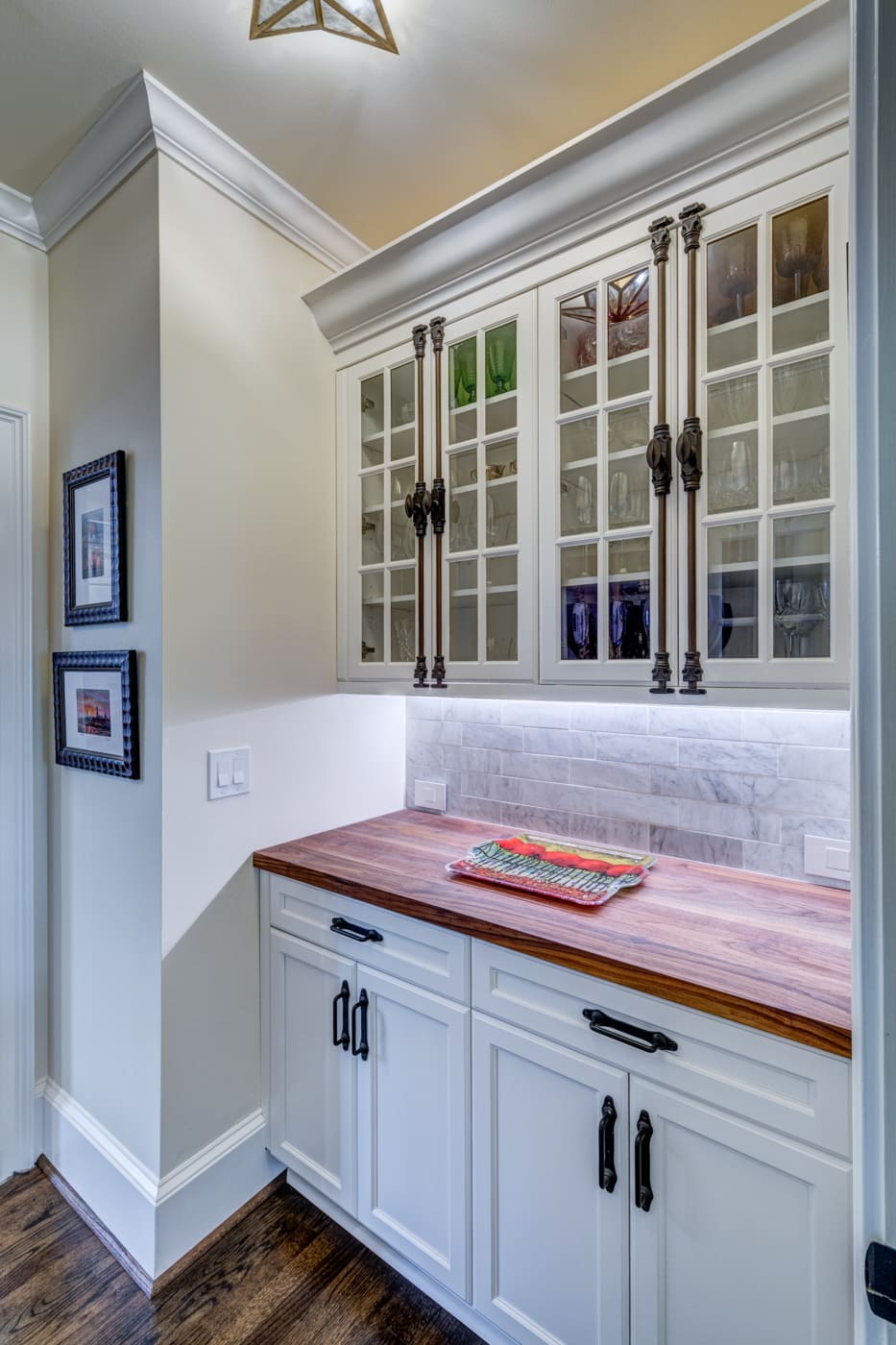 White pantry with display cabinets and wood countertop in Atlanta custom build by Silver Oak Remodeling