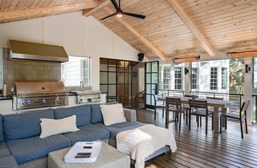 Entertainer’s dream porch with built-in grill and glass doors in Silver Oak Remodeling project in Atlanta, Georgia.