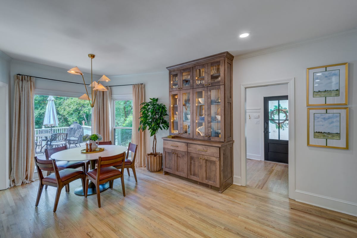 Dining room remodel with custom hutch and patio view by Silver Oak Remodel in Greater Atlanta