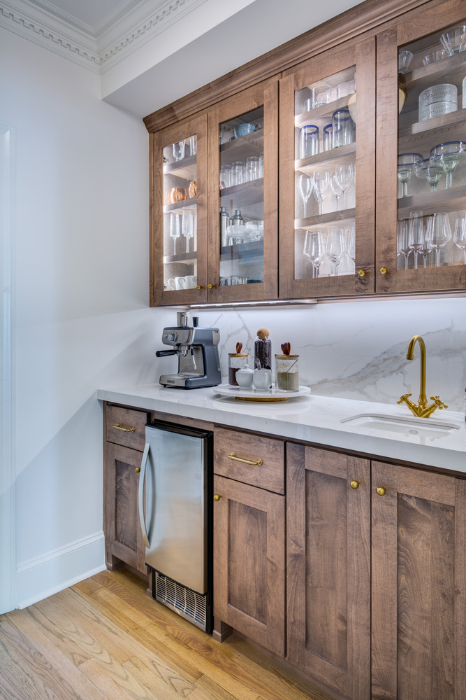 Elegant butlers pantry with wood cabinetry and espresso station by Silver Oak Remodel in Greater Atlanta remodel