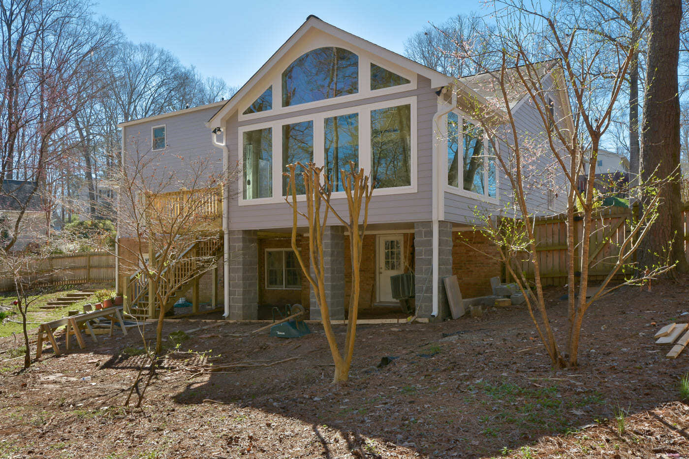 Interior living space with large glass doors overlooking the pool in Atlanta, designed by Silver Oak Remod