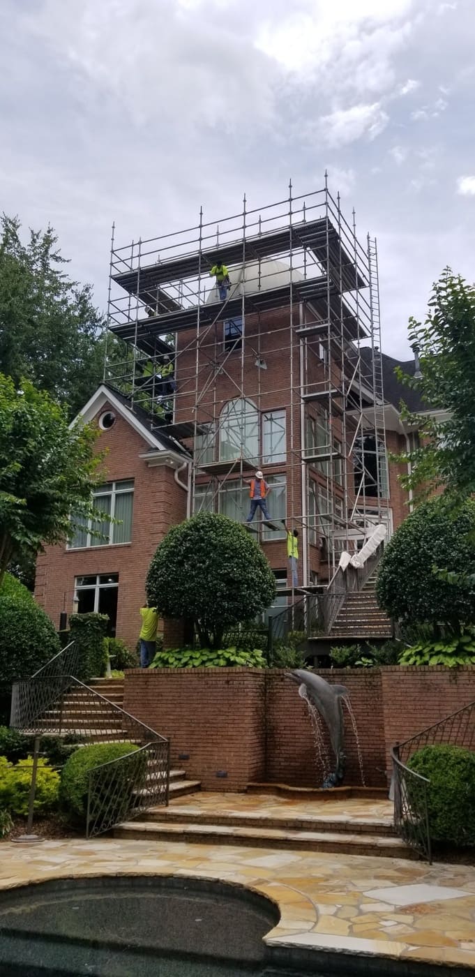 Large custom window installation on modern gable-end home by Silver Oak Remodeling in Atlanta, GA