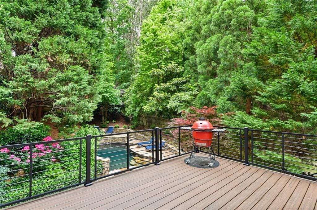 Private deck with grill and pool view in a custom Atlanta home by Silver Oak Remodeling