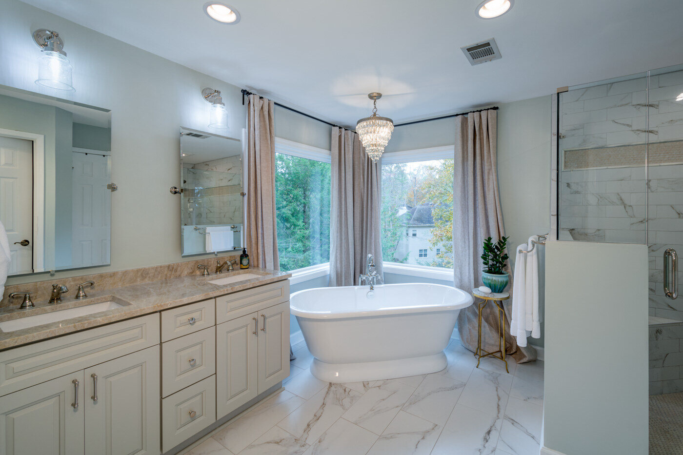 Atlanta bathroom remodel by Silver Oak Remodel featuring a freestanding tub and large corner windows
