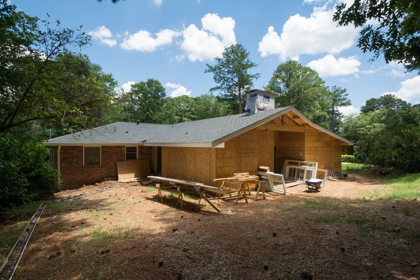 Atlanta construction project with roof installed and siding pending by Silver Oak Remodeling