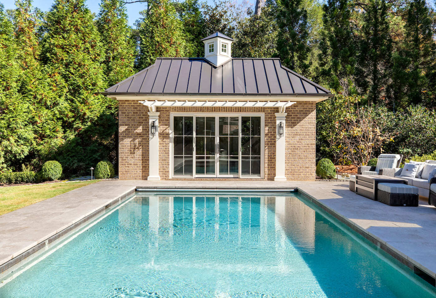 Elegant backyard retreat with pool and cabana by Silver Oak Remodeling in Atlanta, GA