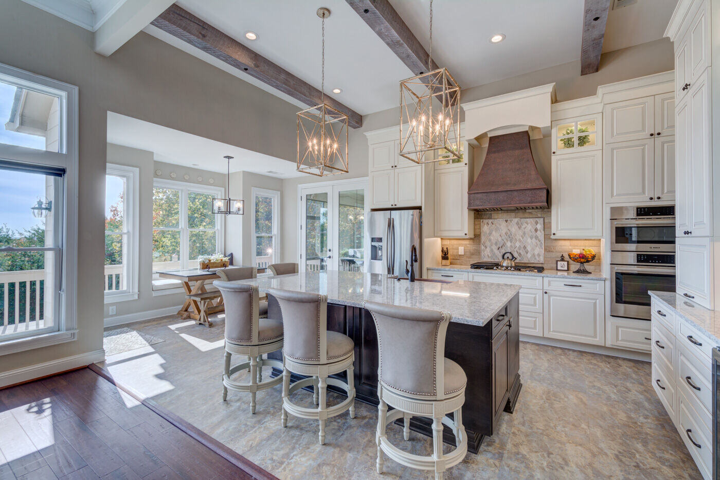 Open-concept kitchen remodel in Atlanta, GA by Silver Oak Remodel with exposed beams and large island