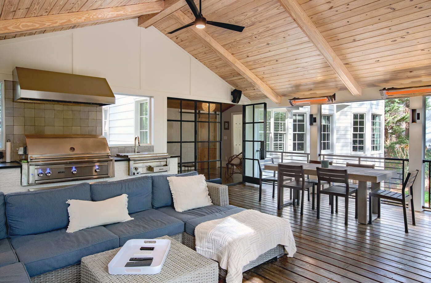 Entertainer’s dream porch with built-in grill and glass doors in Silver Oak Remodeling project in