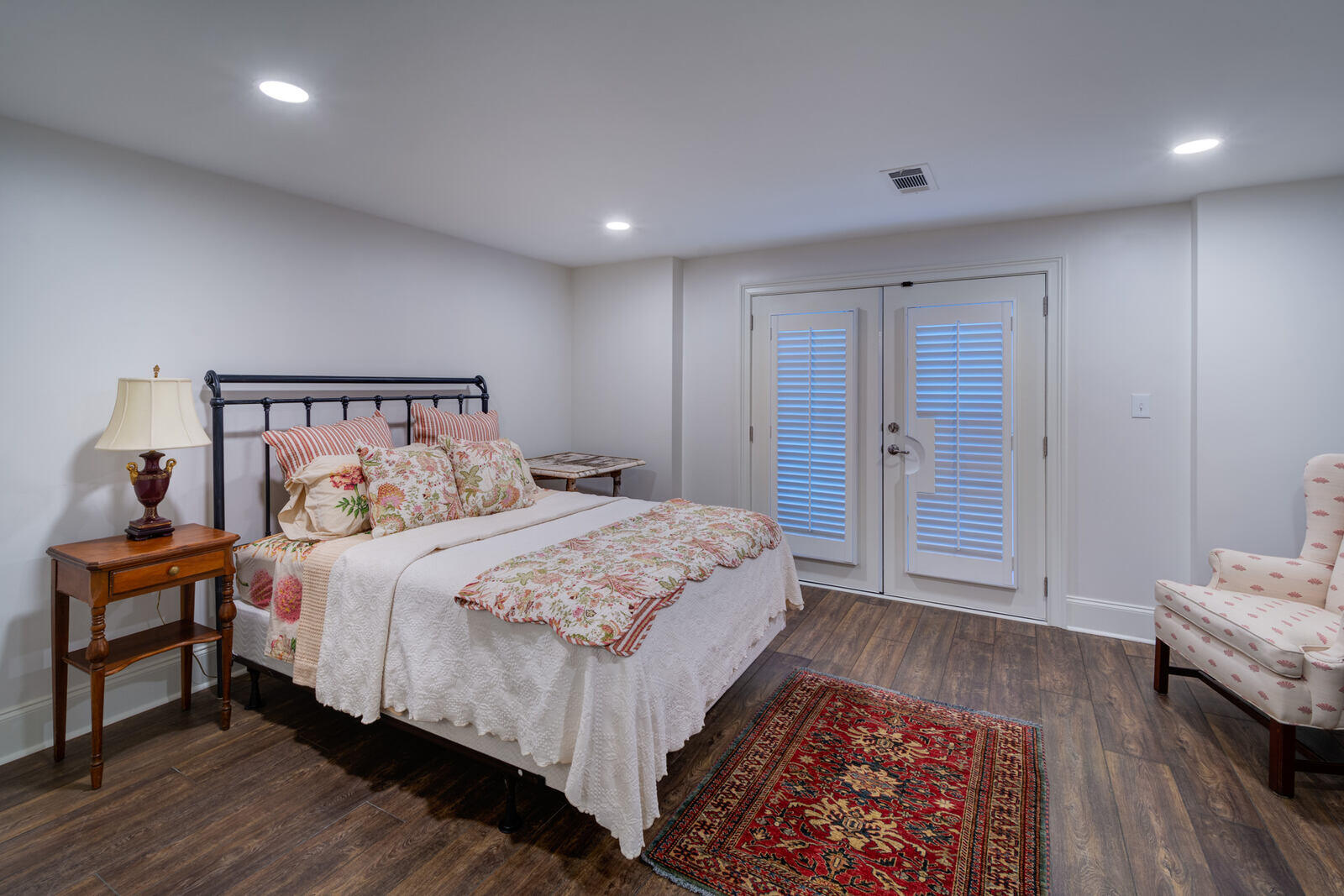 Guest bedroom with floral bedding in Roswell GA basement remodel by Silver Oak Remodel Guest bedroom with floral bedding in Roswell GA basement remodel by Silver Oak Remodel