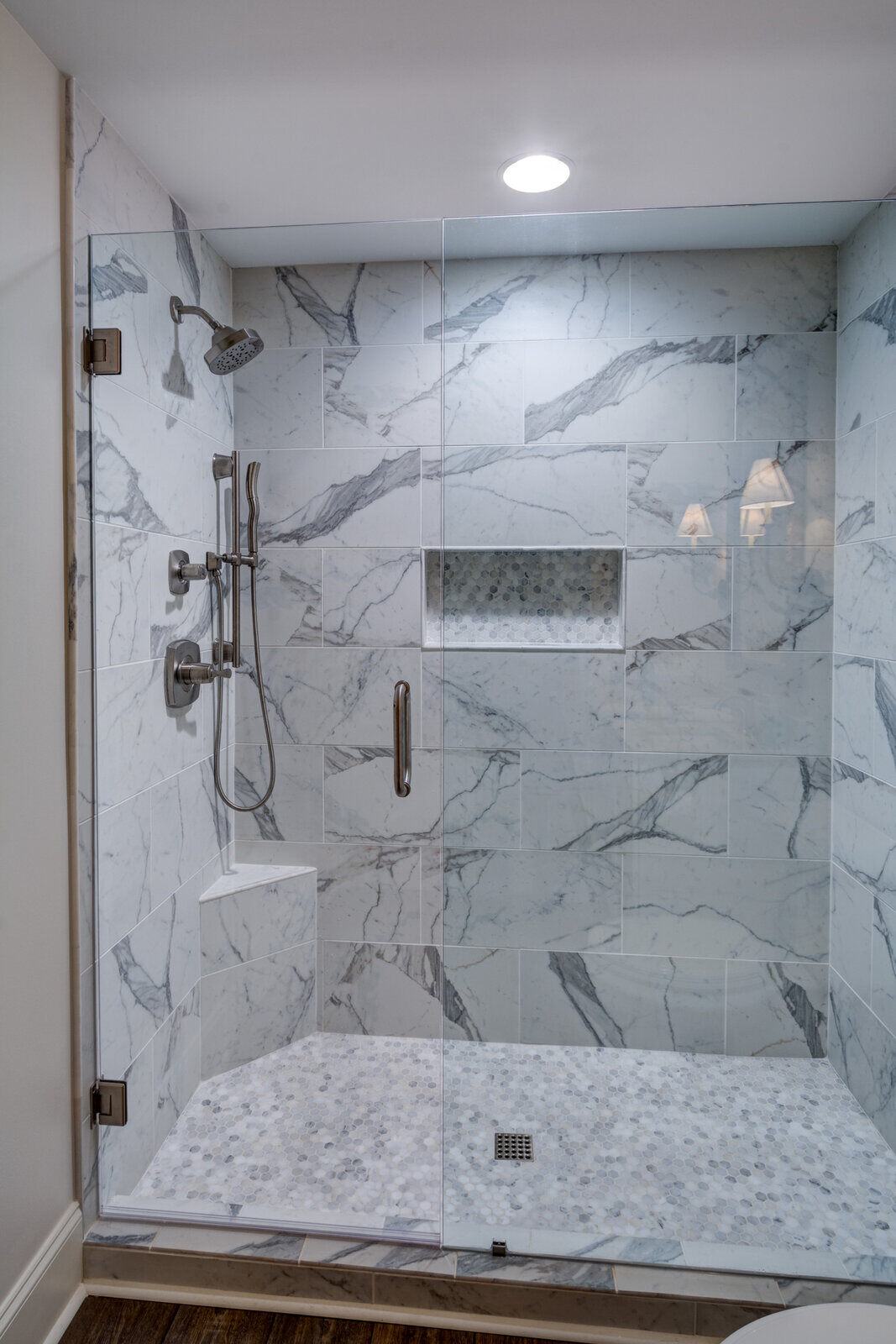 Marble-tiled walk-in shower in Roswell GA basement bath by Silver Oak Remodel Marble-tiled walk-in shower in Roswell GA basement bath by Silver Oak Remodel